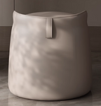 Beige pouf with a handle on a wooden floor