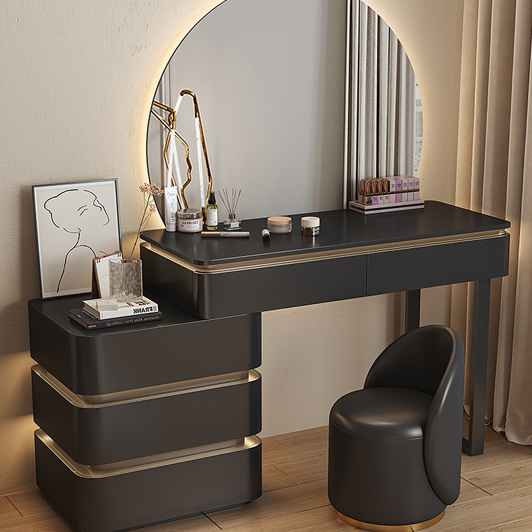Black vanity table with mirror and stool in a room setting
