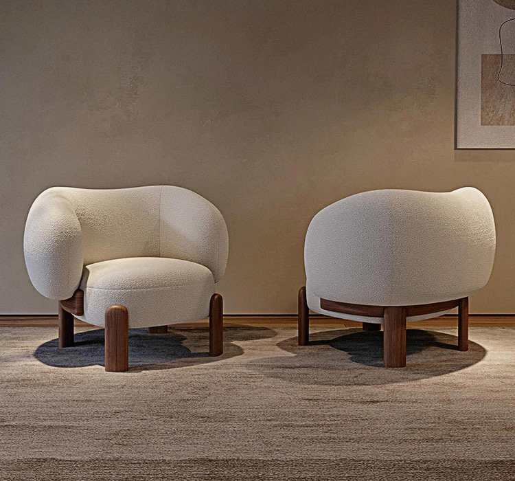 Two modern chairs with wooden legs in a room with a neutral wall and carpet.