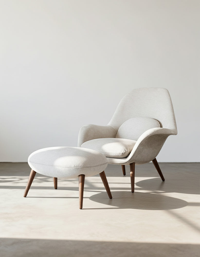 Modern chair and ottoman set with wooden legs on a neutral background