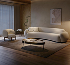 Modern living room with a white sofa, armchair, and coffee table.