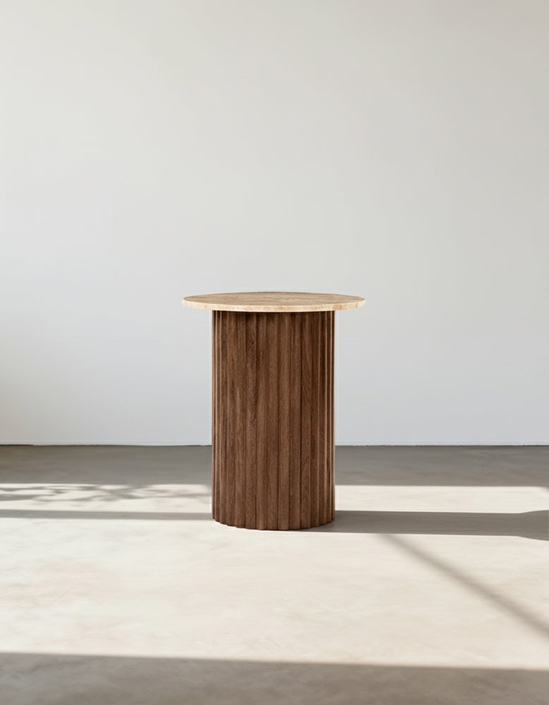 Wooden side table against a plain white wall