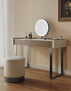 Dressing table with round mirror and stool in a room setting