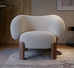 Modern armchair with wooden legs in a room setting