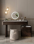 Modern vanity table with mirror and decorative items in a bathroom setting