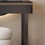 Dark brown console table against a beige wall with a textured surface.
