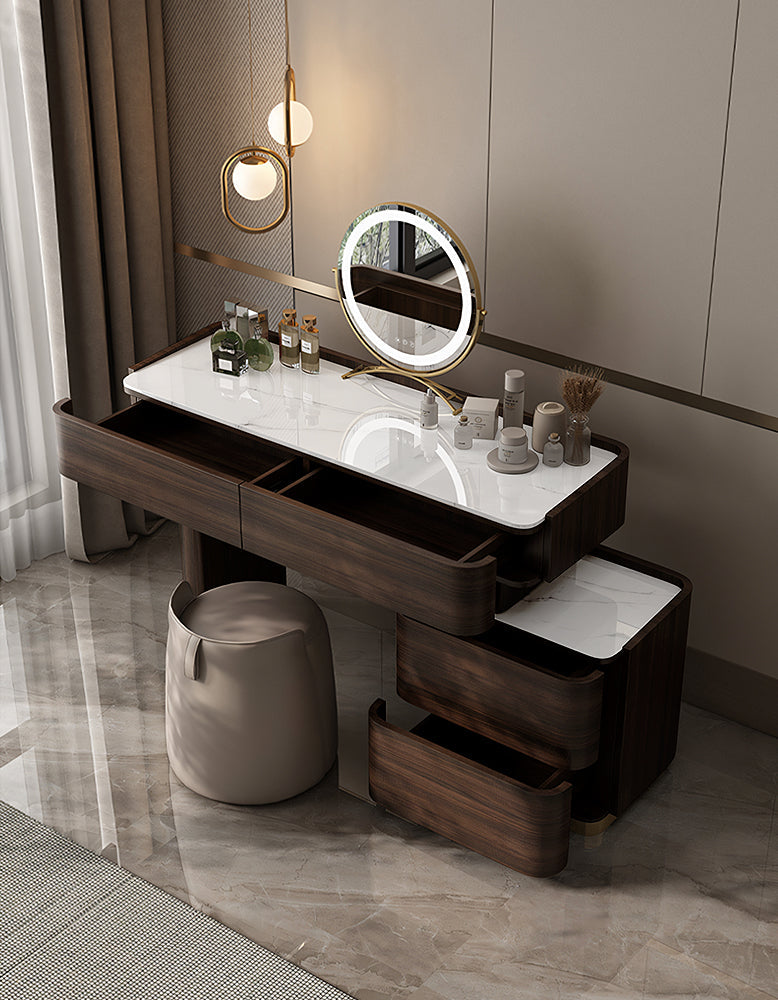 Dressing table with mirror and various items in a room setting