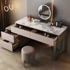 Modern vanity table with marble top and round mirror in a room setting.