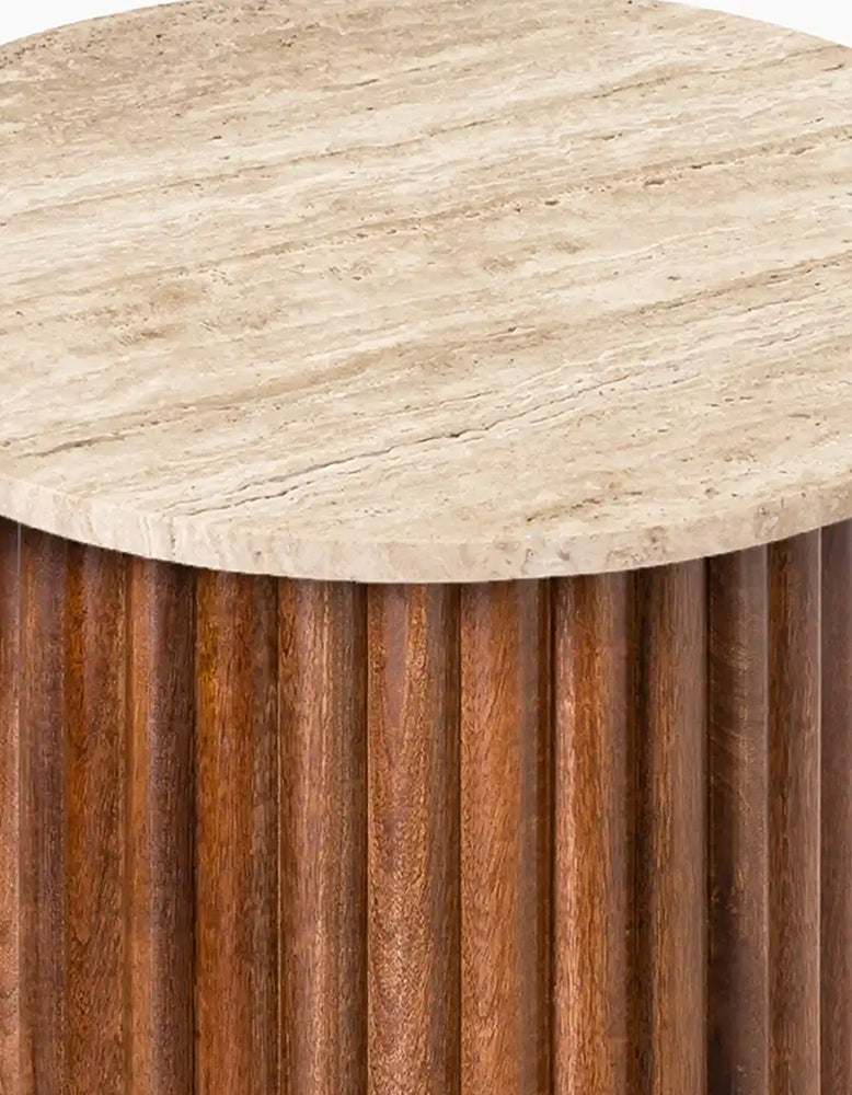 Round wooden side table with a textured surface