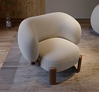 Modern beige armchair with wooden legs on a textured rug