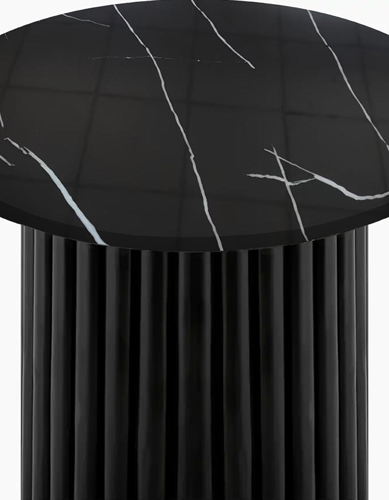 Black marble-patterned tablecloth on a round table