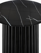 Black marble-patterned tablecloth on a round table