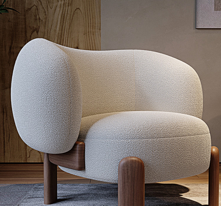 White textured armchair with wooden legs in a room setting