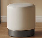 Round beige ottoman with a dark base on a wooden floor.