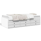 White daybed with storage drawers on a white background