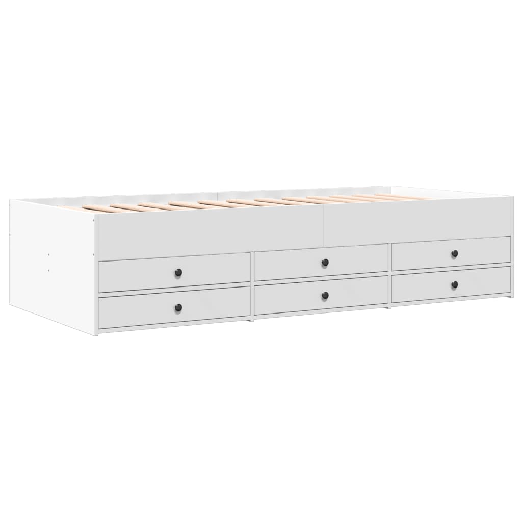 White storage bed with multiple drawers on a white background