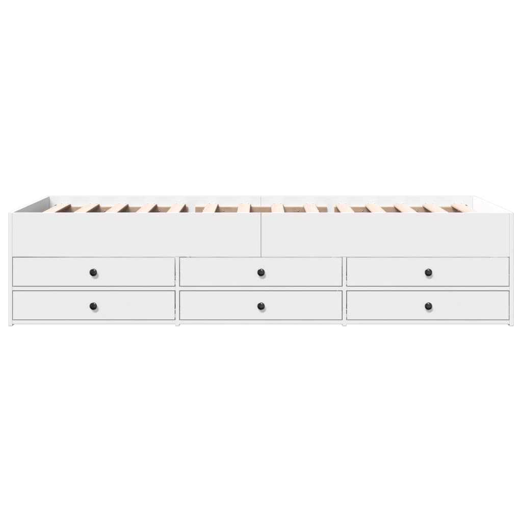 White storage bed with multiple drawers on a white background