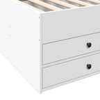 White dresser with black knobs on a white background