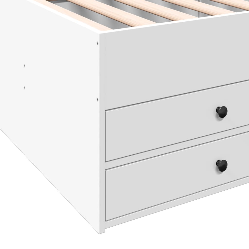 White dresser with black knobs on a white background
