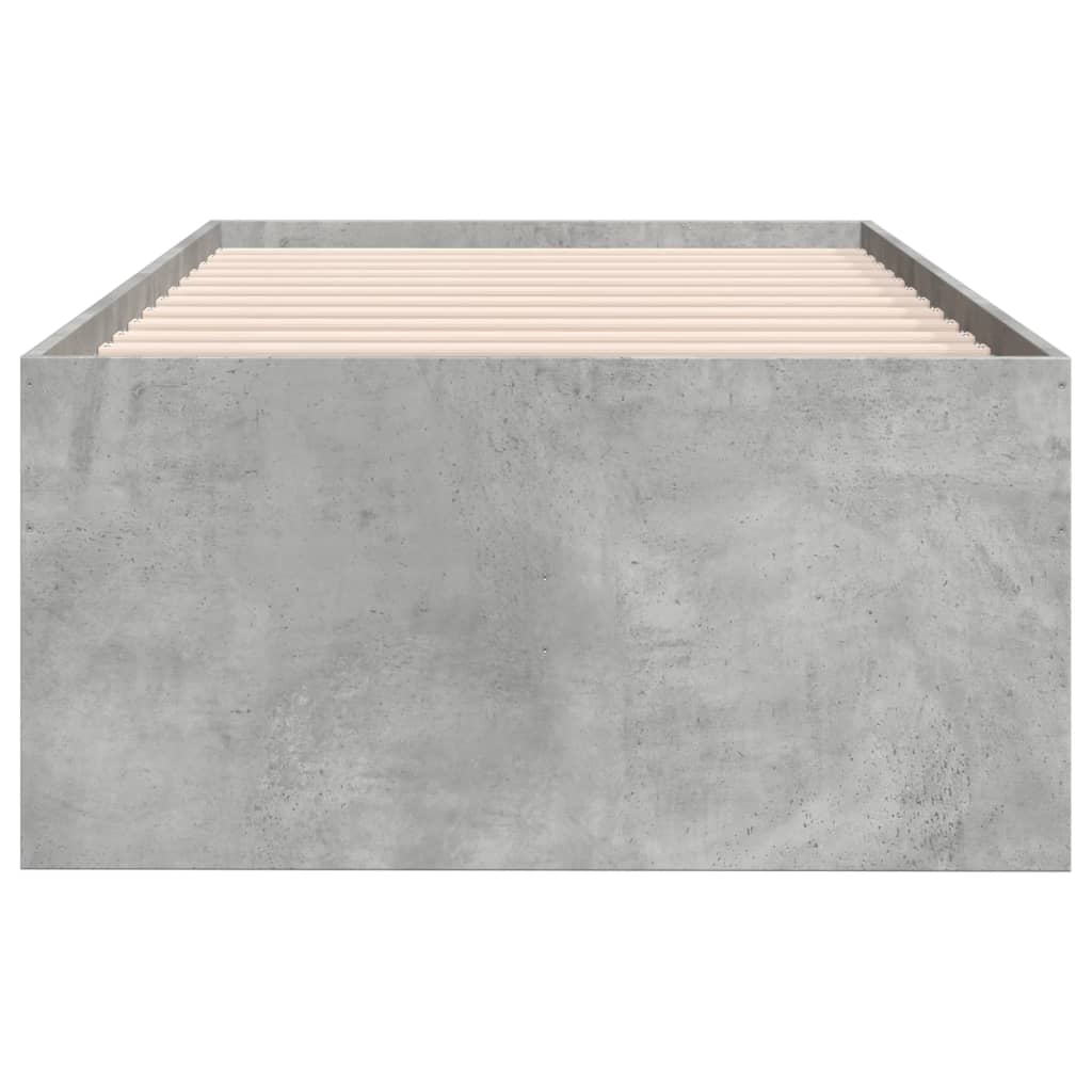 Concrete bed frame with wooden slats on a white background
