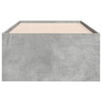 Concrete bed frame with wooden slats on a white background