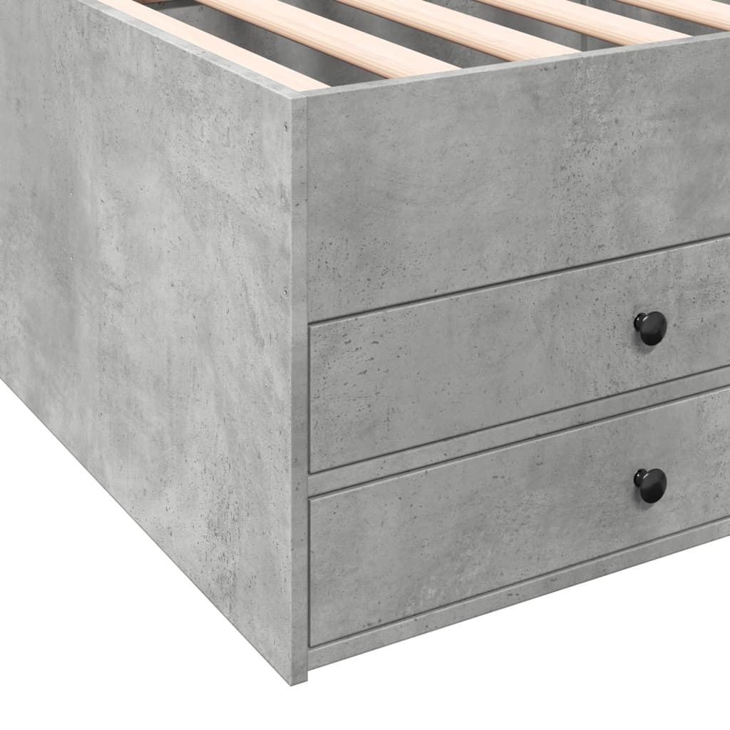 Gray concrete bed frame with wooden slats and two drawers.