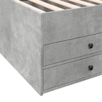 Gray concrete bed frame with wooden slats and two drawers.