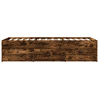 Wooden bed frame with drawers on a white background