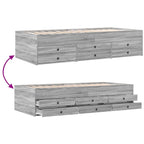 Gray wooden bed frame with drawers on a white background