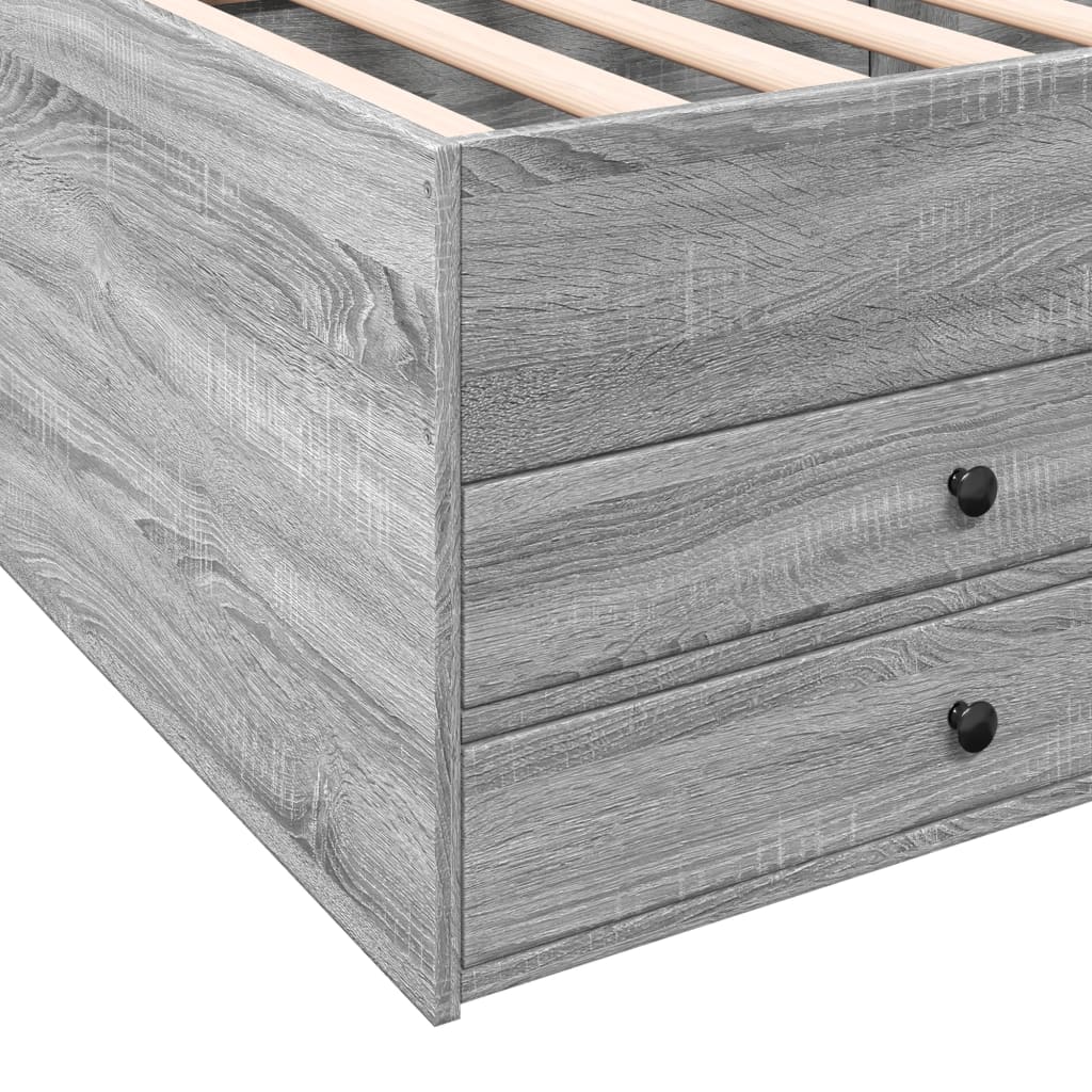 Gray wooden bed frame with two drawers and a slatted headboard on a white background