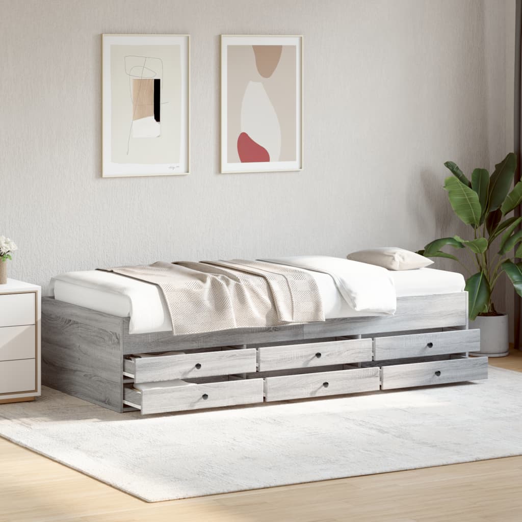 Wooden bed frame with storage drawers in a bedroom setting.