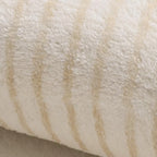Close-up of a textured beige fabric surface