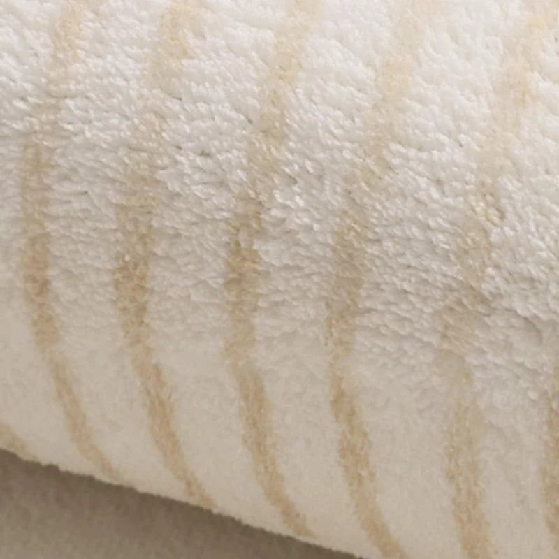 Close-up of a textured beige fabric surface