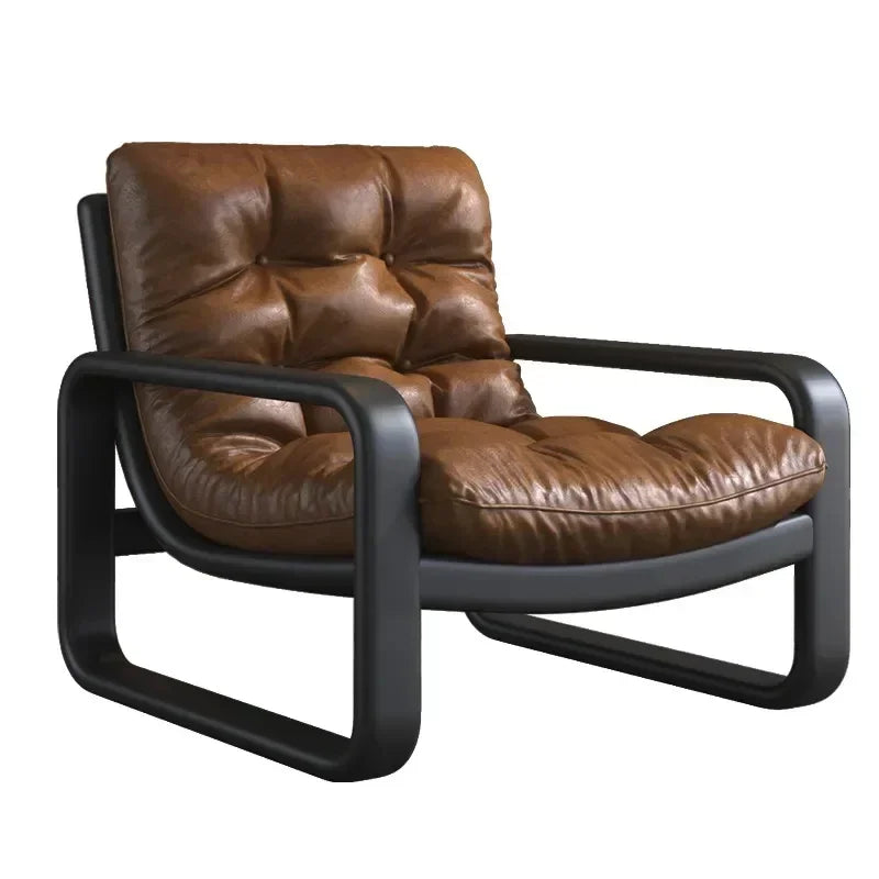 Brown leather armchair with black frame on a white background