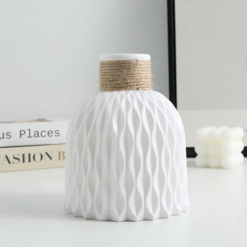 White textured vase with woven top on a light surface