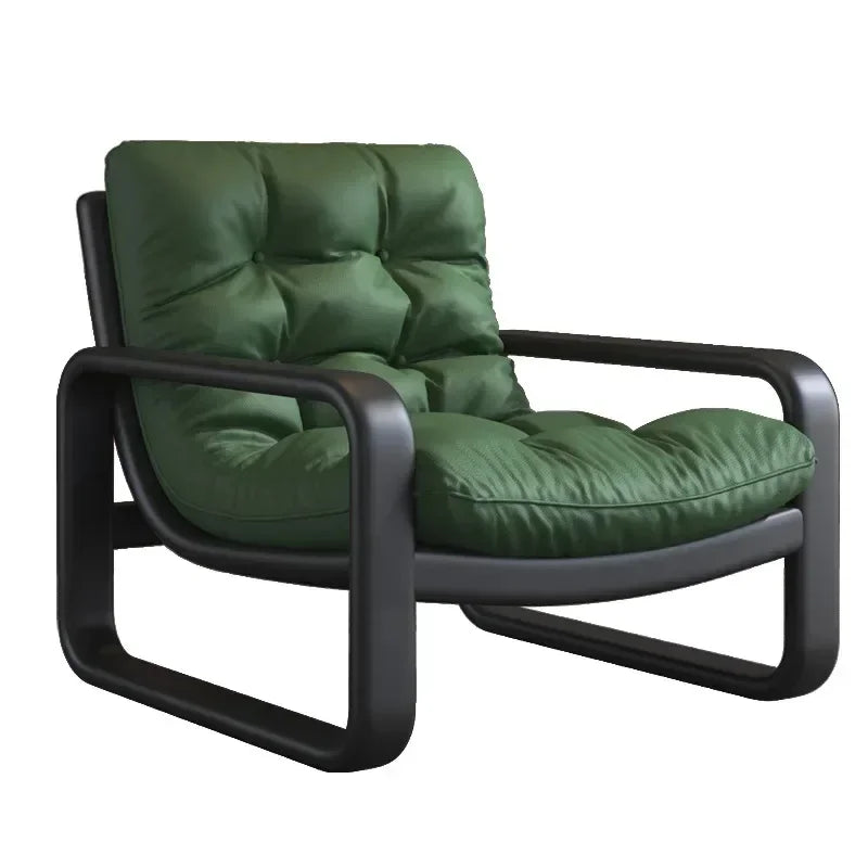 Green armchair with black frame on a white background