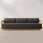 Gray sofa with wooden frame on a plain background