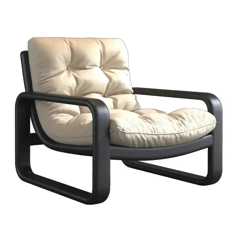 Beige cushioned chair with black frame on a white background