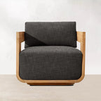 Gray upholstered armchair with wooden frame on a white background