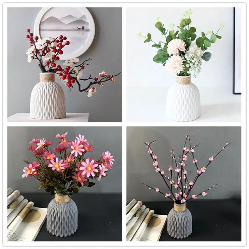 Four different floral arrangements in textured vases on a plain background
