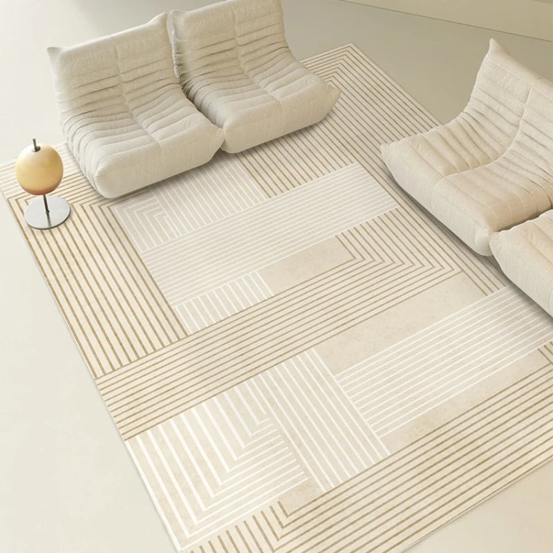 Beige geometric patterned rug on a light wooden floor with a beige sofa.