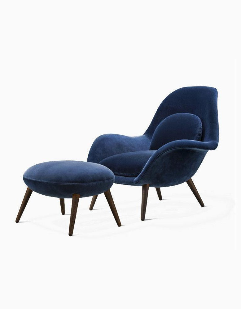 Blue armchair with ottoman on a white background