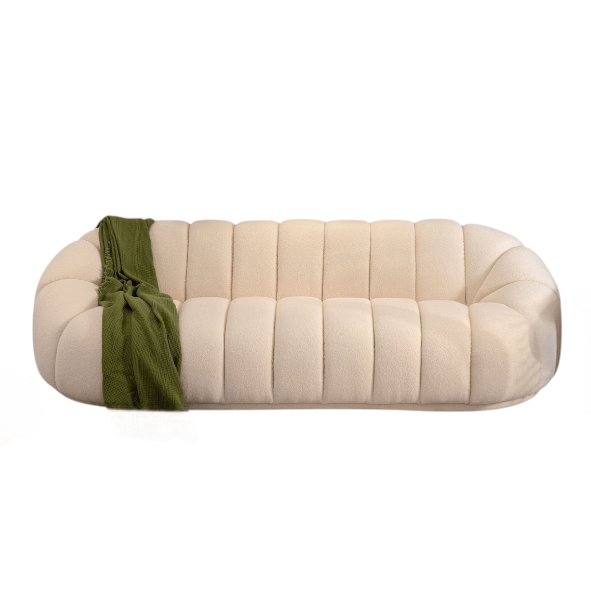 Beige quilted sofa with a green blanket on a white background